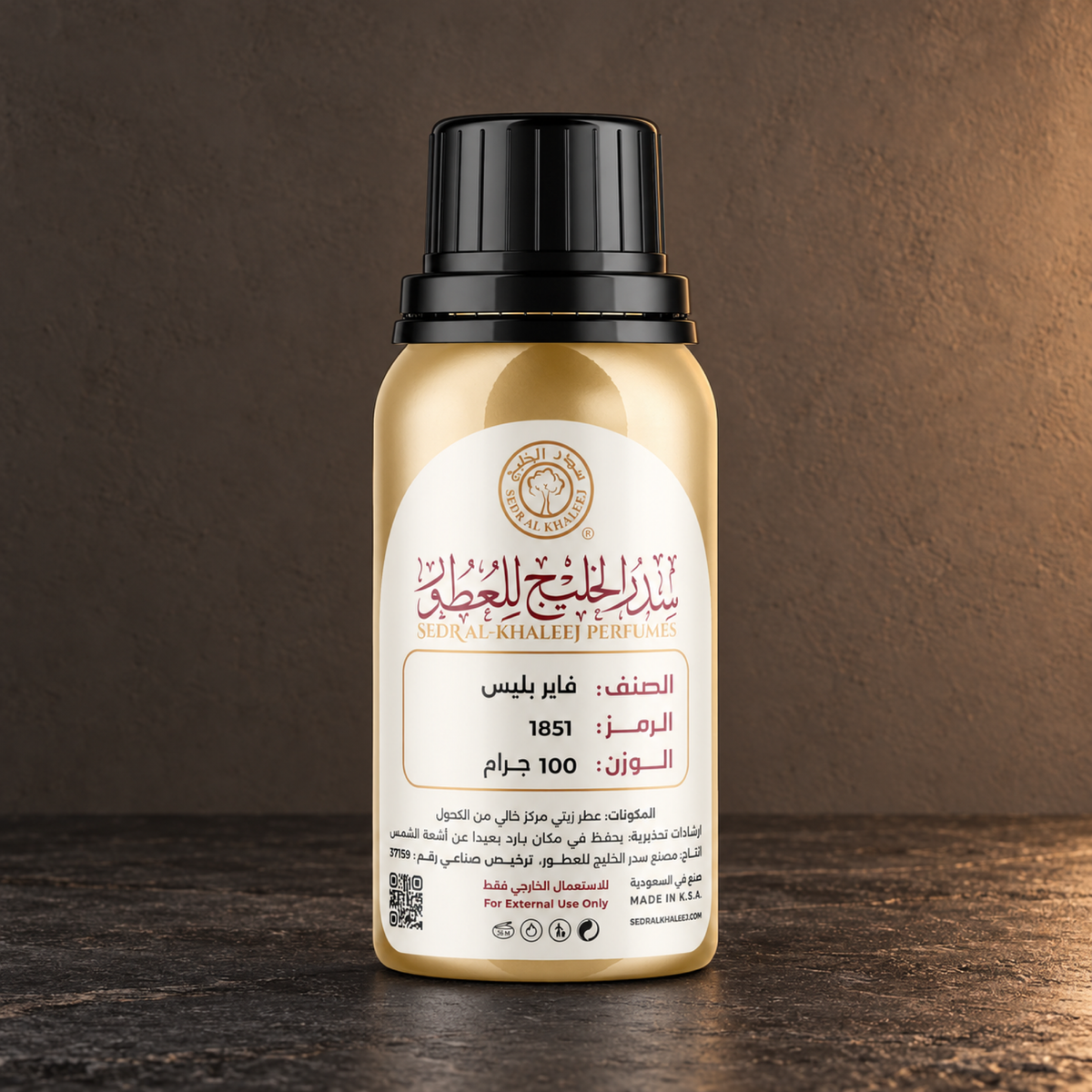 Sedr Al-Khaleej fireplace perfume oil; one closed original bottle on honed charcoal basalt before a charcoal cocoa, muted ember taupe backdrop.