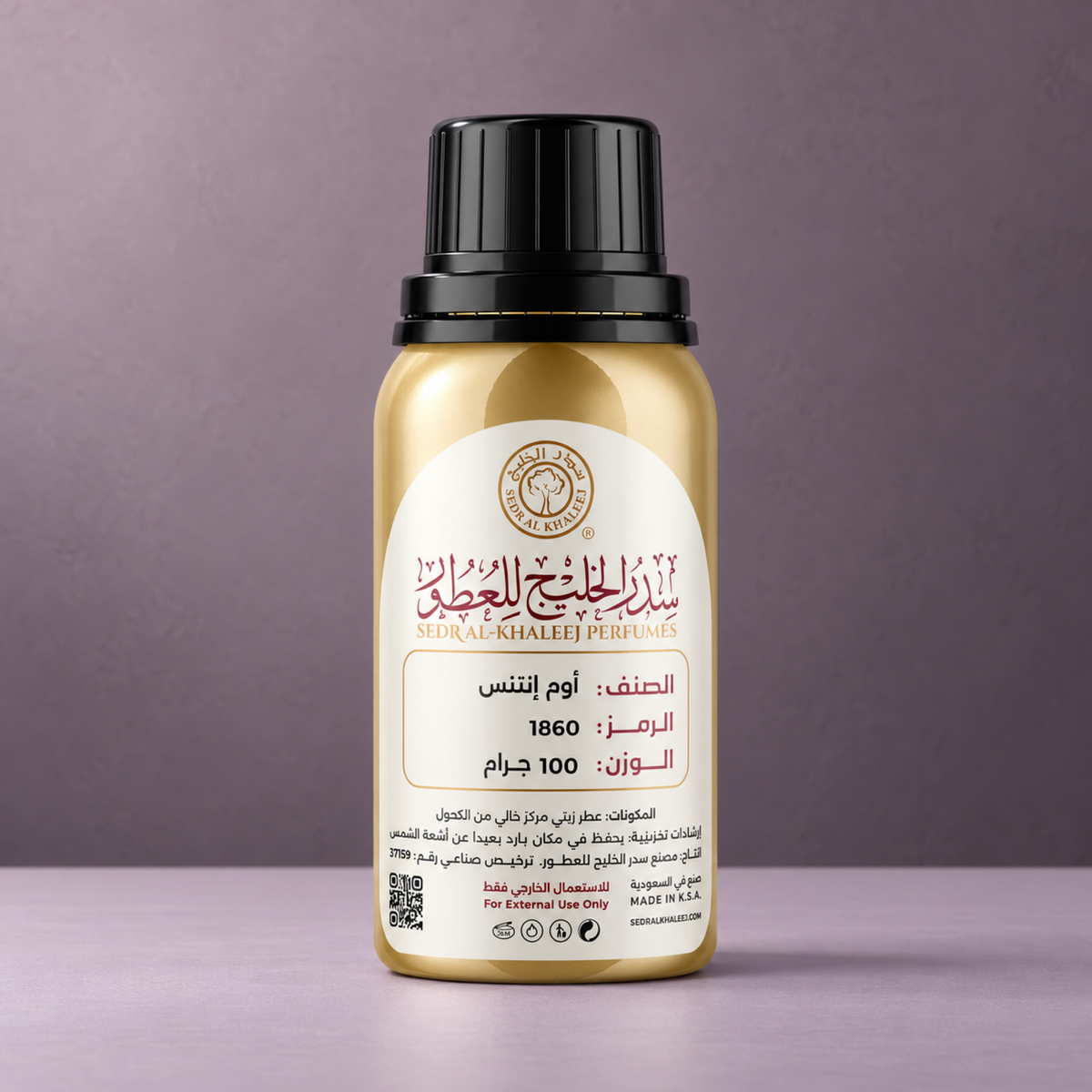 Sedr Al-Khaleej homme intense perfume oil gold bottle on pale lilac matte porcelain, against plain smoky mauve plaster