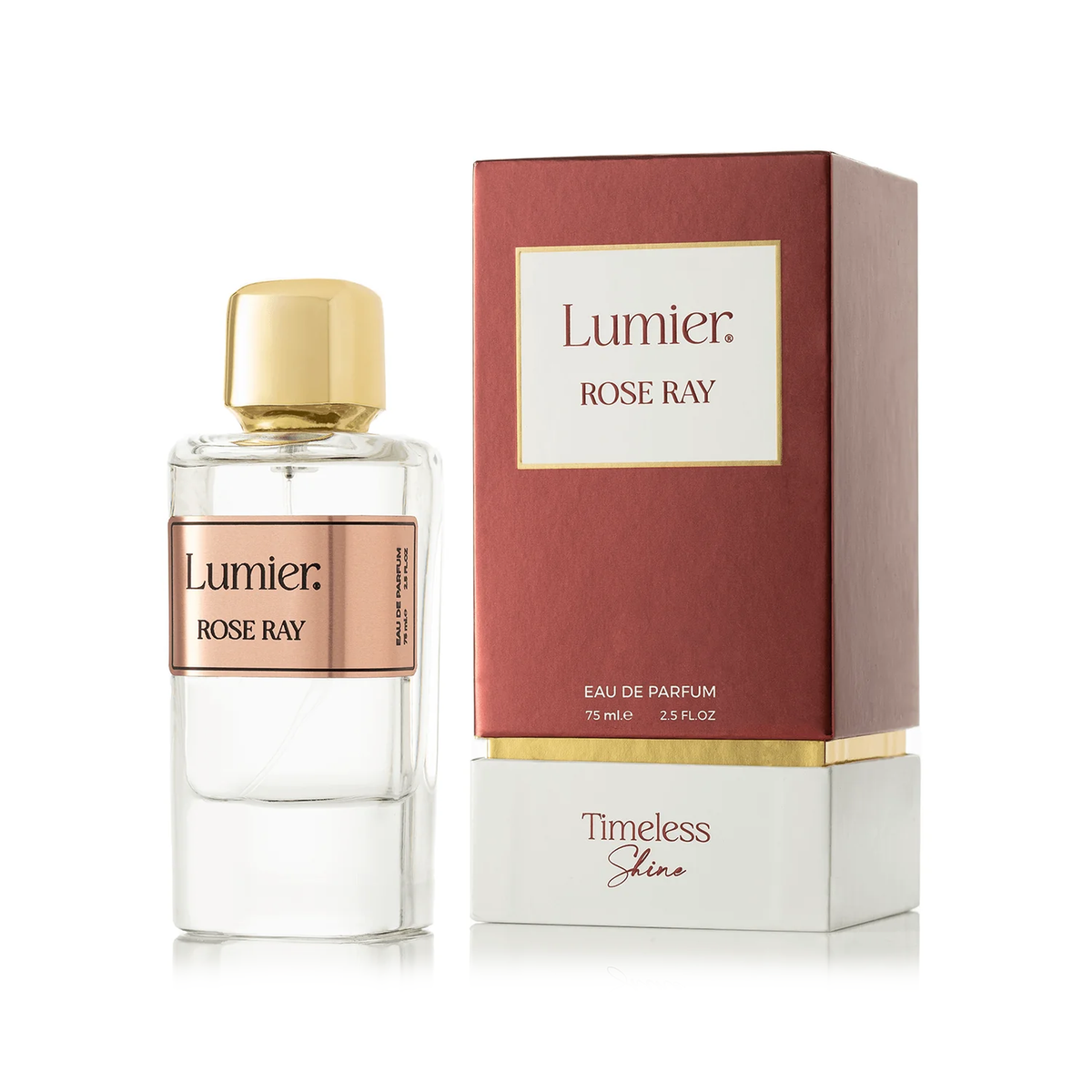 عطر روز راي 75 مل بزجاجة شفافة وغطاء ذهبي بجانب علبته الحمراء والبيضاء على خلفية بيضاء