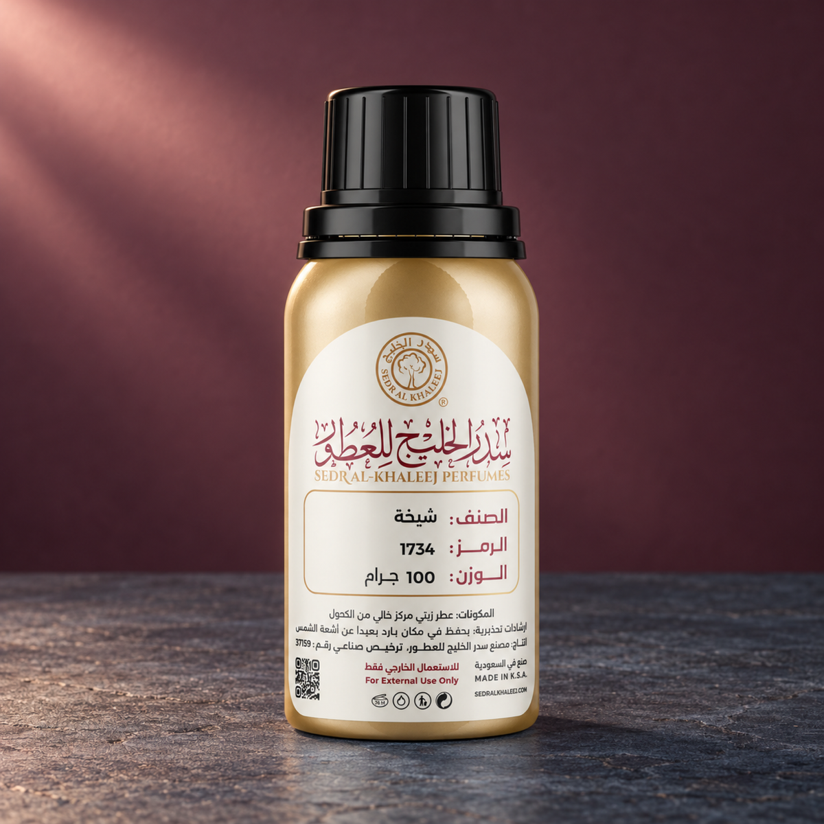 Sedr Al-Khaleej sheikha perfume oil; one closed original bottle on blue-grey basalt before a deep dusty rose, muted plum charcoal backdrop.