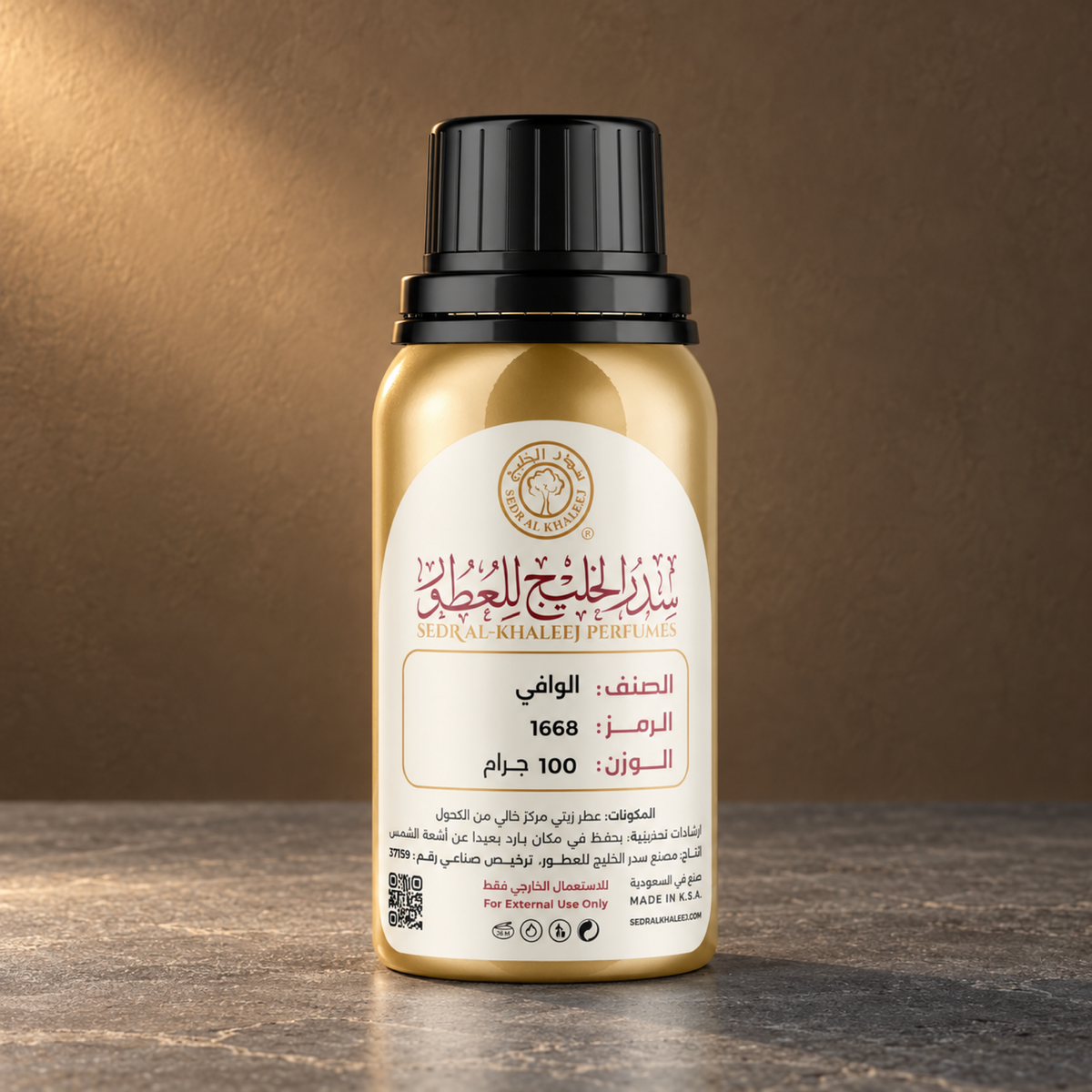 Sedr Al-Khaleej Alwafi perfume oil, gold bottle on grey basalt against a muted bronze backdrop with balanced side light