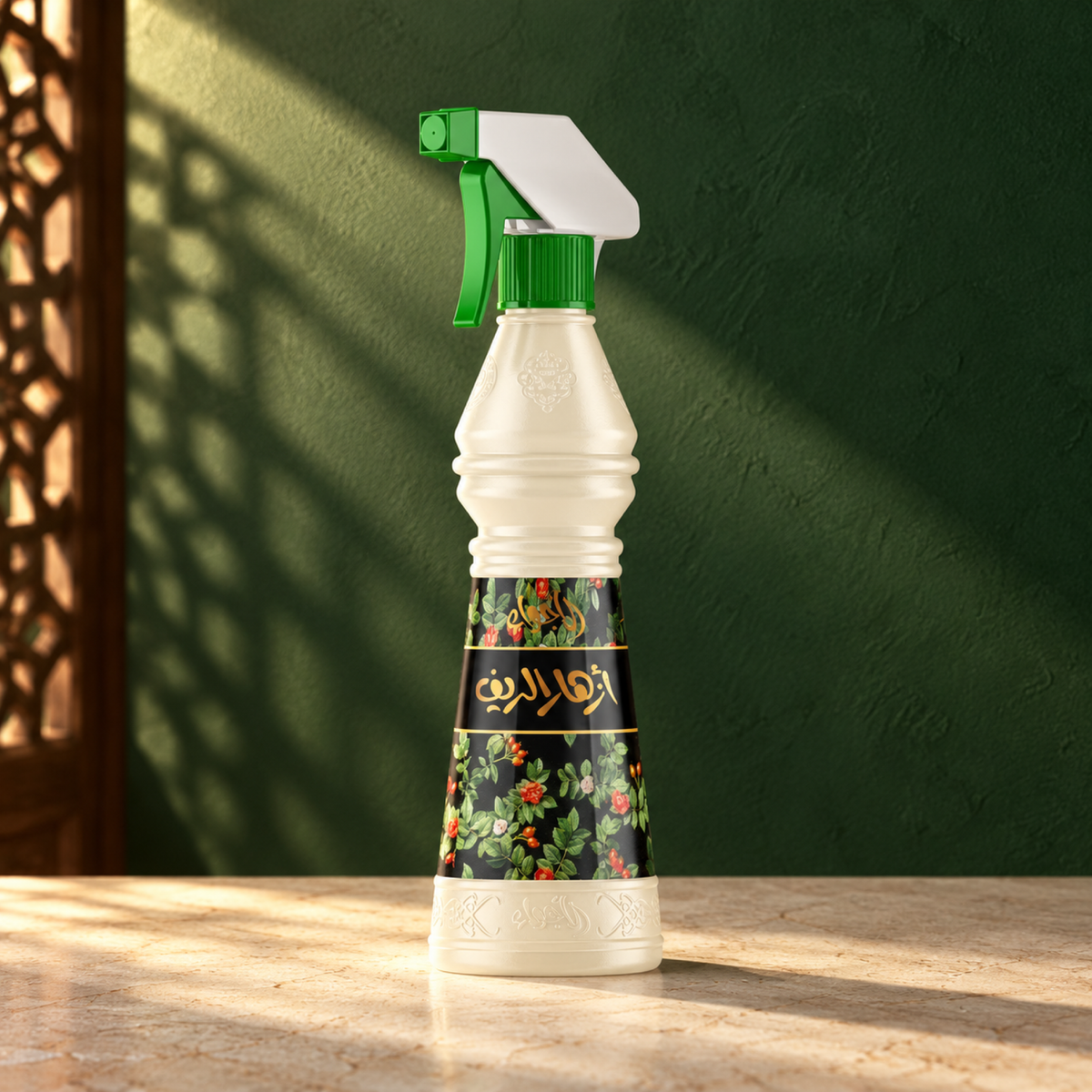 Azhar Al-Reef Air Freshener 500 ml from Sedr Al-Khaleej; spray bottle with a green trigger on cream stone against a dark green sunlit wall.