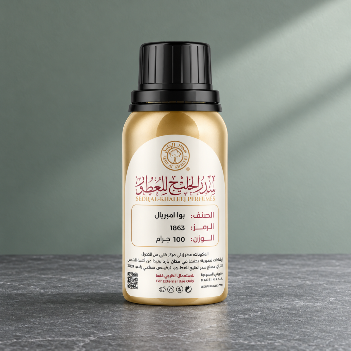 Sedr Al-Khaleej bois imperial perfume oil; one closed original bottle on honed medium-grey slate, against plain mist-sage wall.
