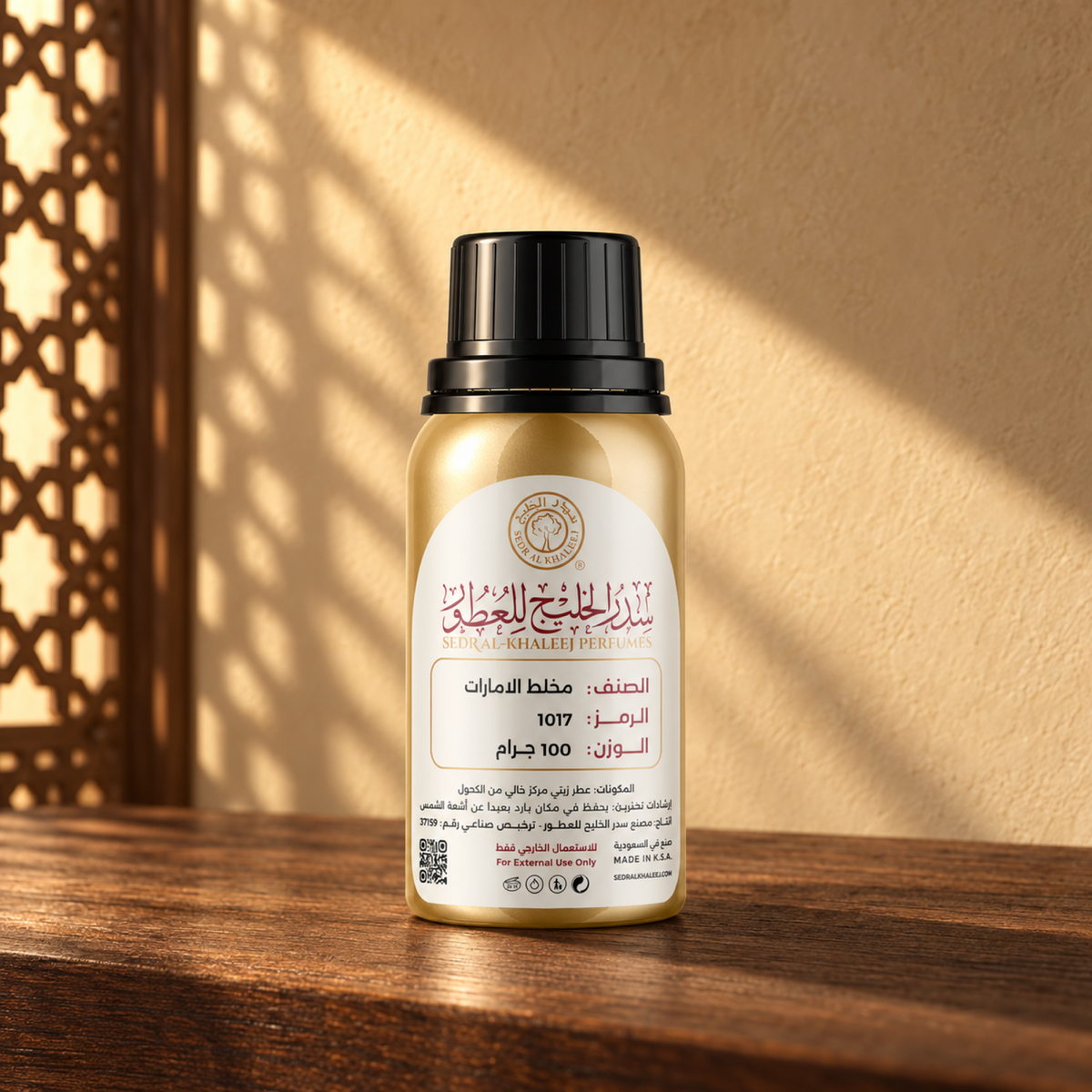Sedr Al-Khaleej Emirates Mukhalat Perfume Oil bottle on a walnut surface in warm sunlight