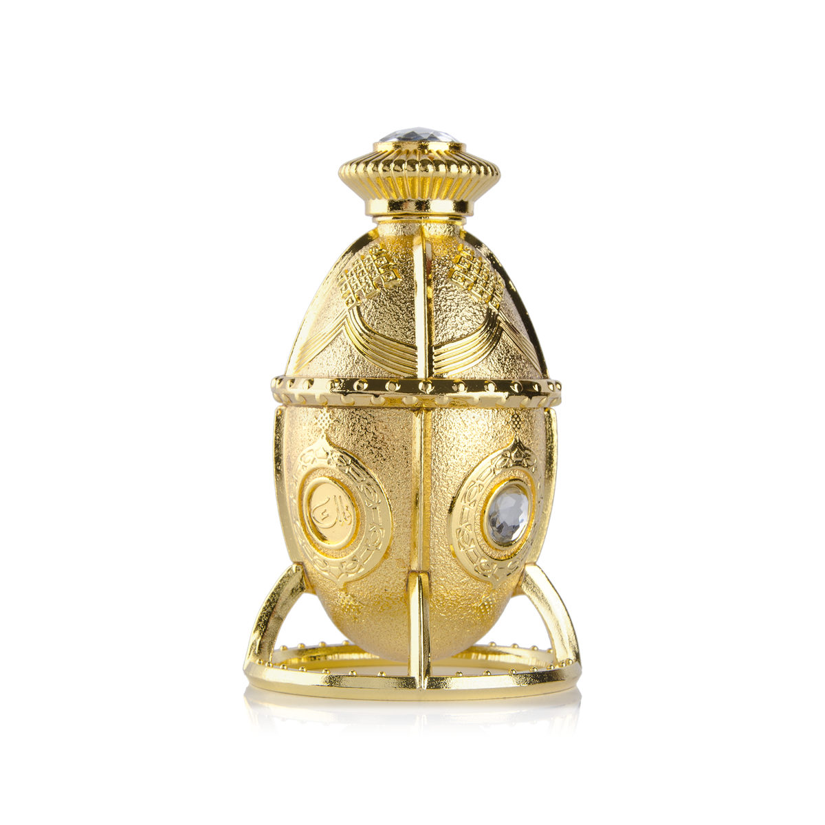 Falak Mukhallat 12 ml oval gold bottle with clear stones on its stand alone on a white background