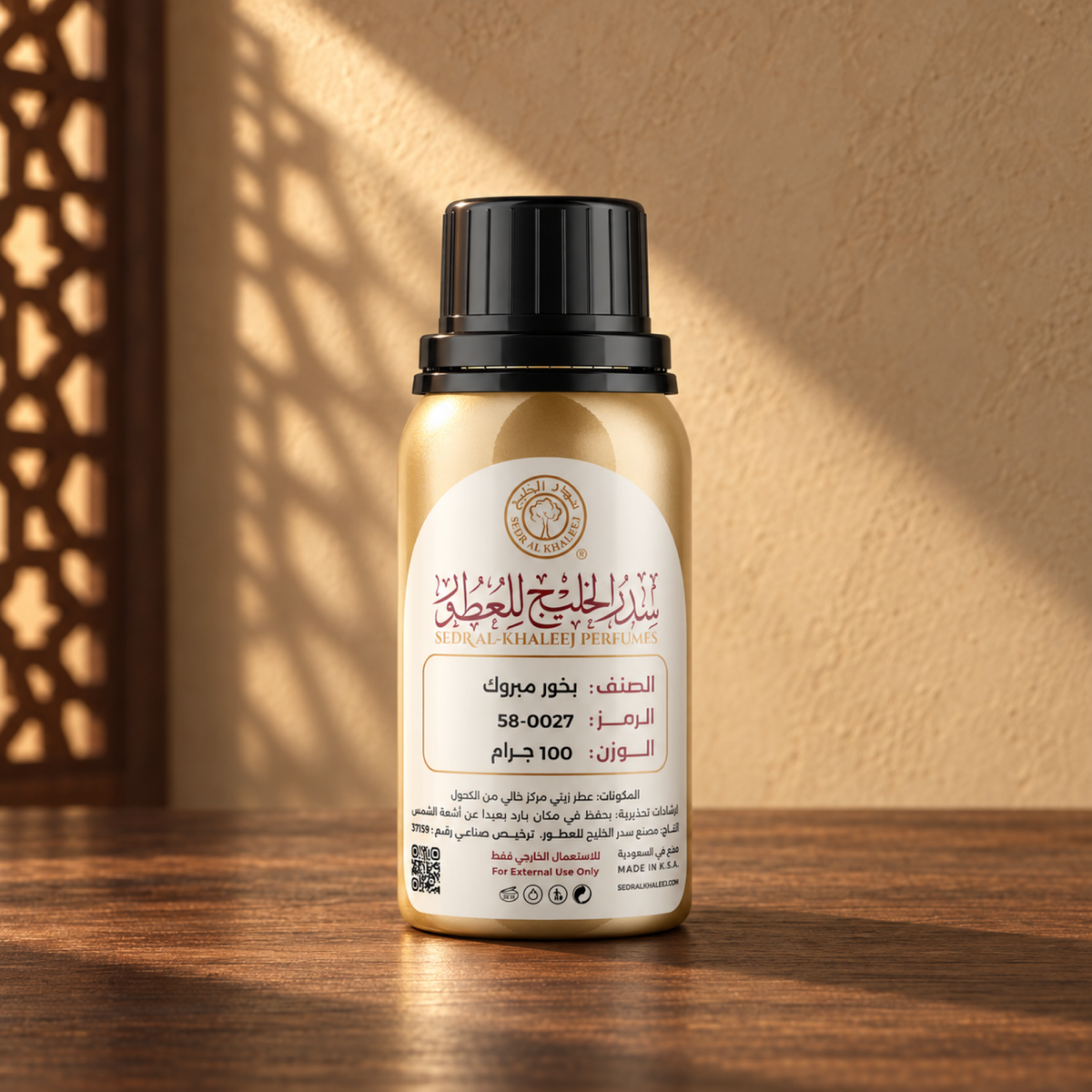 Sedr Al-Khaleej Mabrook Perfume Oil bottle on a walnut surface in warm sunlight