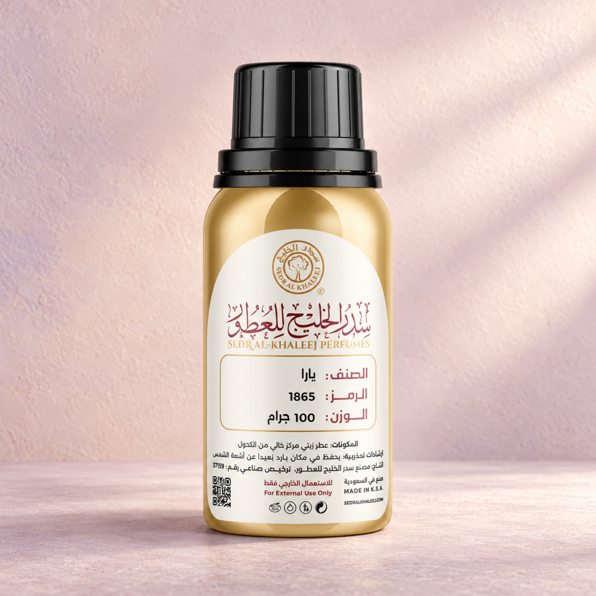 Sedr Al-Khaleej yara perfume oil; one closed original bottle on powder-mauve limestone, almost smooth fine grain, against pale peach-blush plaster wall with delicate lilac undertone.